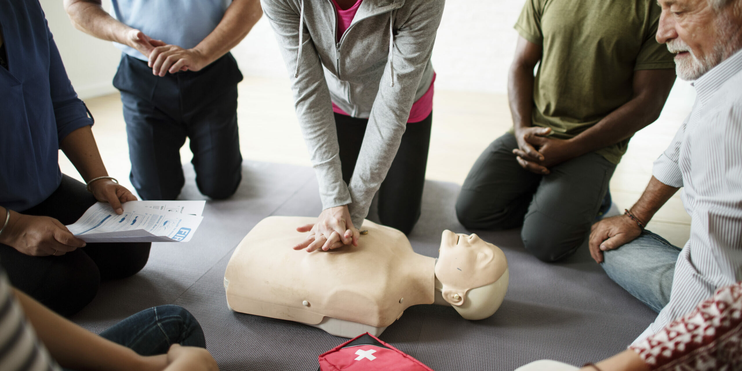 Group of diverse people in cpr training class